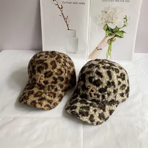 Stylish leopard print teddy fleece baseball hats with metal TR logo on white fabric