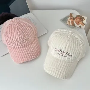 Fuzzy plush baseball caps with 1997 embroidery in pink and cream white colors