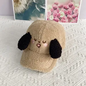 Detail of embroidered puppy face and plush ears on a cozy lamb wool baseball cap