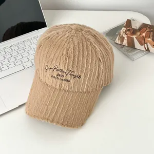 Detailed close-up of khaki plush baseball cap with Grow Positive Thoughts embroidery