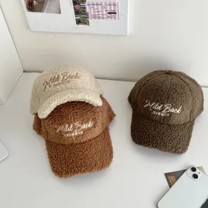 Three lamb wool baseball caps in cream and brown with Mild Back WINTER embroidery