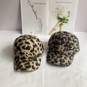 Detail of leopard print teddy fleece baseball caps with metallic TR embroidery
