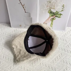 Detail view of the thick faux fur baseball cap showing inner lining and stitching