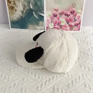 Close-up of soft sherpa fleece texture with cute puppy ear design on a baseball cap