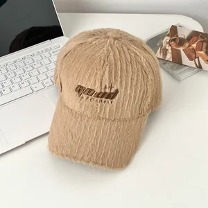 Detailed view of khaki plush baseball cap featuring a premium 3D embroidered GOOD letter logo