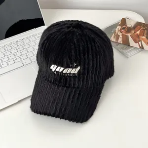 Detail of black faux fur baseball cap with GOOD 3D embroidery and soft ribbed texture
