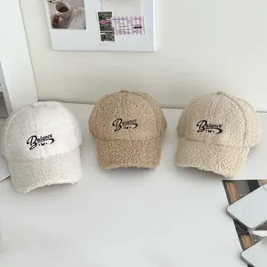 Three lamb wool baseball caps with Balance embroidery in white, camel, and grey colors
