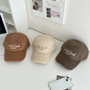 Winter plush baseball caps in brown and beige with Mild Back embroidered lettering