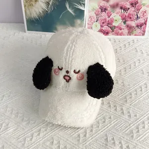 Detail of white sherpa baseball cap featuring embroidered puppy face and black plush ears
