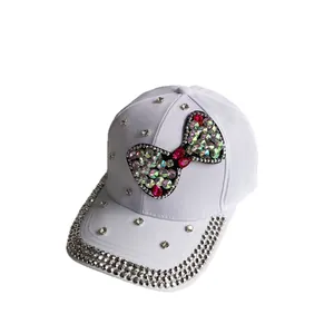 White denim baseball cap with rhinestone bow and pearl star decor for sun protection