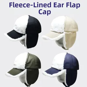 Detail of fleece-lined brim and ear protection flaps on winter peaked caps in four colors