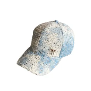 Distressed blue and white tweed baseball cap with sequins and a pearl bow decoration