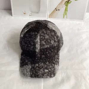 Detailed macro view of the thick gray teddy fleece fabric on the baseball cap