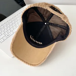 Detailed interior of a brown plush baseball cap showing black fabric lining and mesh design