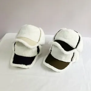 Winter thermal trapper hat with white faux fur earflaps and contrast baseball brim
