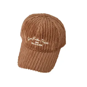 Brown fuzzy plush baseball cap with white letter embroidery and striped faux fur texture