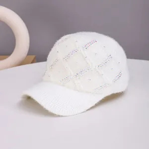 White knit baseball cap with diamond pattern and sparkling rhinestone embellishments