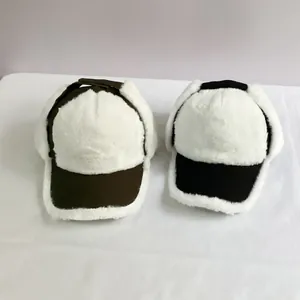 Winter thermal earflap baseball caps in olive green and black with thick white faux fur lining