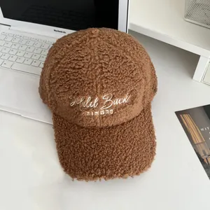 Close-up of winter brown sherpa baseball cap featuring white Mild Buck embroidery detail