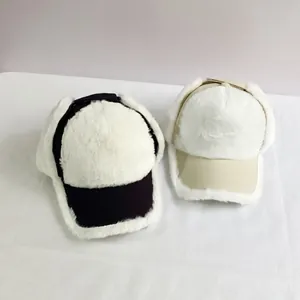 Detail of plush faux fur lining on windproof winter trapper baseball caps in two colors