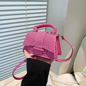 Pink woven mini hourglass handbag with top handle and detachable strap for women