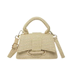 French hourglass straw handbag with woven texture and a stylish curved bottom silhouette