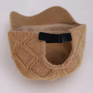 Detail view of khaki knit baseball cap back with ponytail hole and adjustable strap