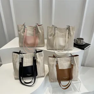 Fashion straw woven tote bags in four colors with chain straps and leather pockets