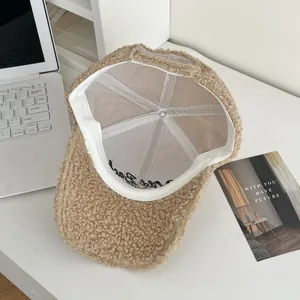 Detailed interior of khaki faux shearling baseball cap showing soft sweatband and lining