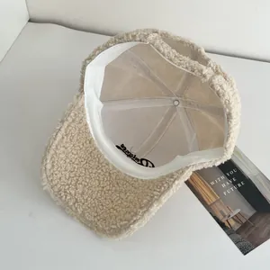 Detail of cream teddy fleece baseball cap interior showing sweatband and embroidery