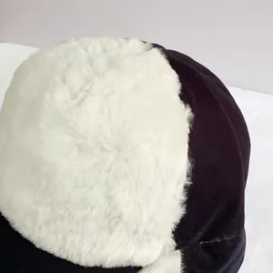 Close-up of the thick faux fur lining and ear flaps on the winter trapper hat