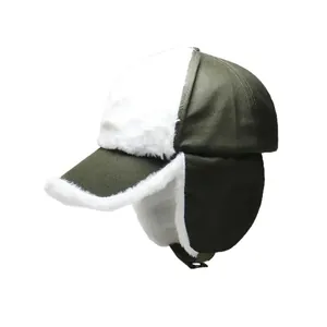 Dark green winter trapper hat with white fleece lining and earflaps for wind protection