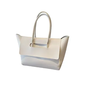 Minimalist white leather wing tote bag with large capacity and bat-shaped silhouette