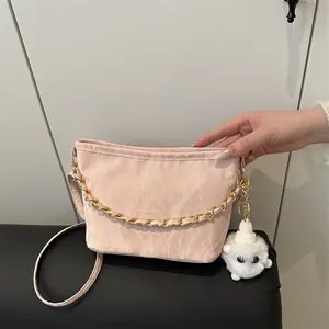 Pink marbled tote bag for women with gold chain strap and cute plush pompom accessory