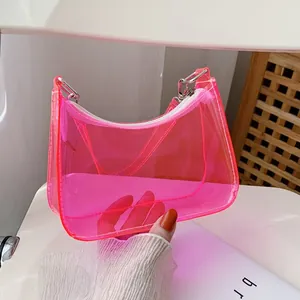Pink transparent PVC shoulder bag featuring silver metal hardware and zipper detail