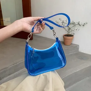 Blue translucent PVC hobo bag with white stitching detail and adjustable strap