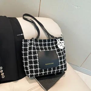 Fashion plaid tote bag with black leather pocket and cute white cat charm accessory
