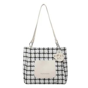 Large capacity tweed tote bag with black and white plaid pattern and tiger charm