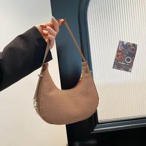 Brown woven hobo bag for women with herringbone texture and gold hardware detail