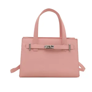 Elegant pink lychee texture leather handbag with silver lock and crossbody strap