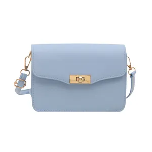 Light blue faux leather crossbody square bag with gold twist lock and adjustable strap