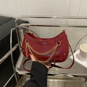 Chic burgundy crocodile embossed leather underarm bag with gold chain decoration for women