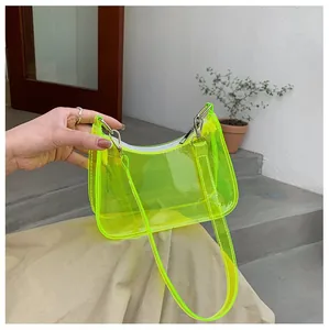 Detail of neon green PVC transparent shoulder bag with silver hardware and zipper