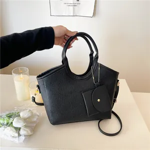 Fashionable black tote bag with 3D floral embossing and small detachable pouch