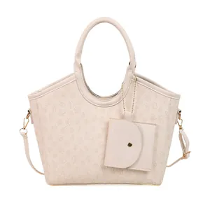 Chic beige clover embossed tote bag with top handles and detachable crossbody strap