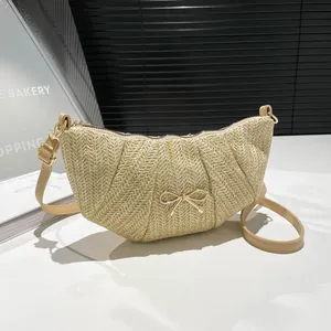 Beige woven bow shoulder bag with crescent shape and stylish leather strap for women