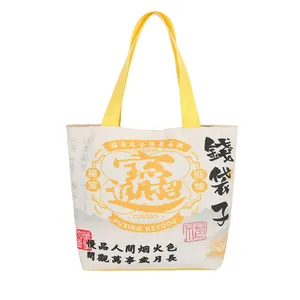 Canvas bucket bag with yellow handles featuring Chinese zodiac snake year calligraphy