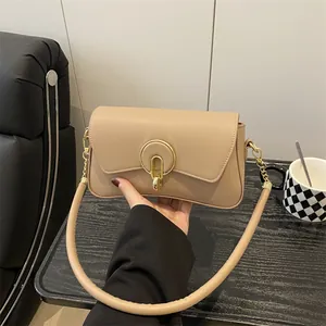 Bolso de hombro minimalista albaricoque con cierre dorado y asa cilíndrica gruesa