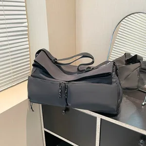 Large capacity black travel fitness bag with durable fabric and front zipper pockets