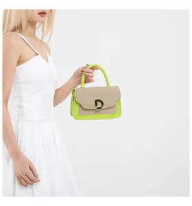 Detail of neon green contrast handbag with beige texture and black D-shaped metal buckle